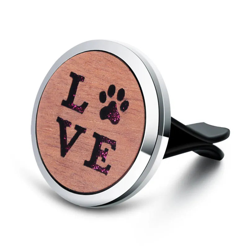 Round car vent aromatherapy clip in alloy wood construction showing hollow centre for incense