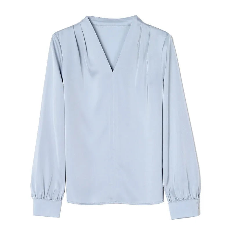 Women's blue satin shirt with long sleeves and slim fit showing 3D stitching detail