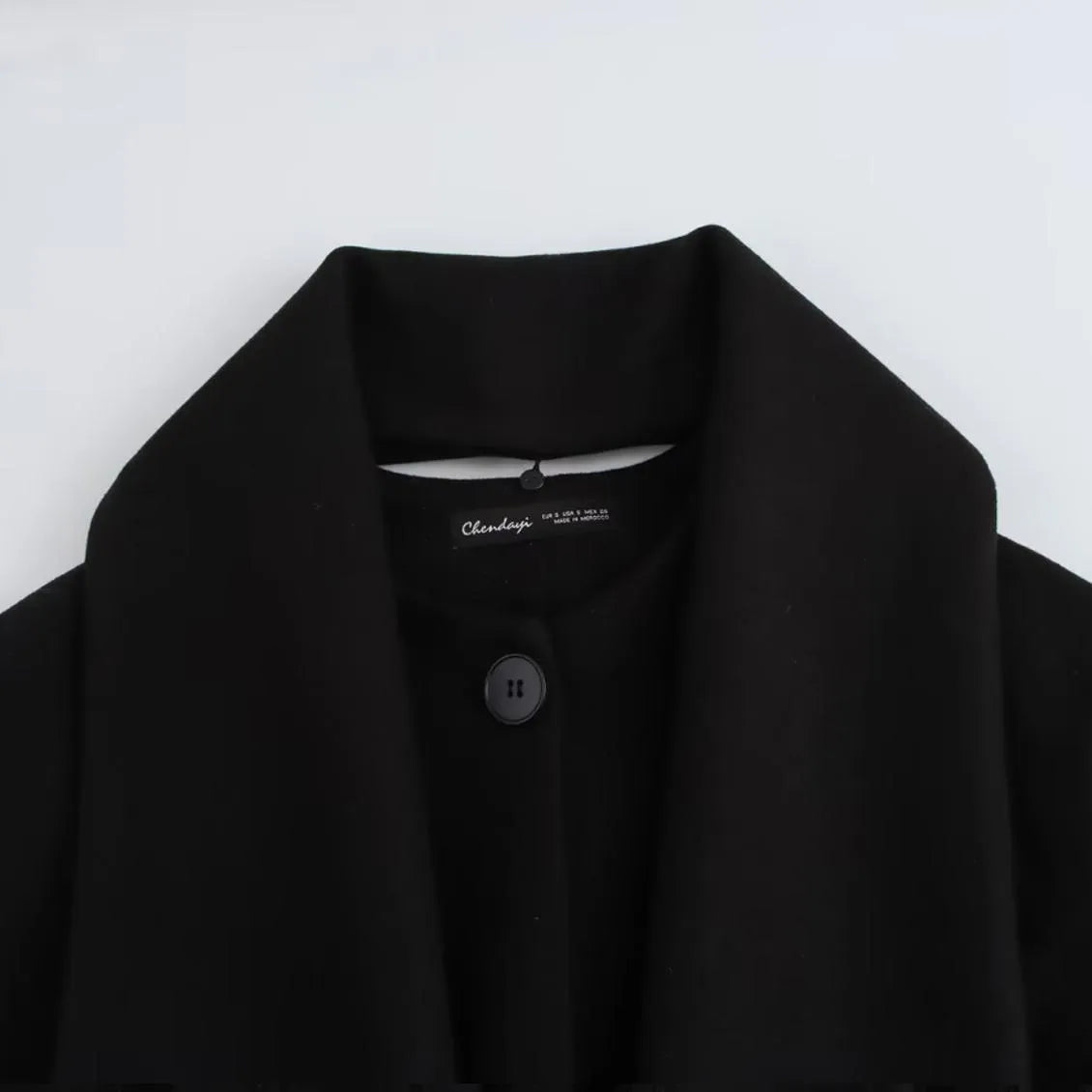 Women's longline polyester coat with an artificial fur collar in a street fashion style.