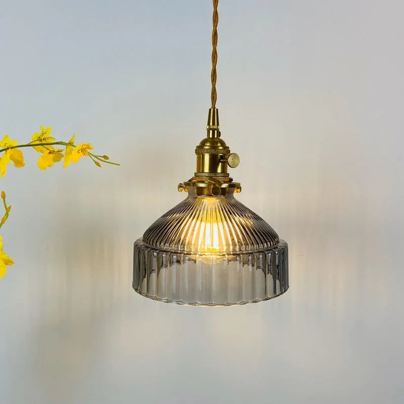Nordic-style brass and glass chandelier light fixture with an adjustable cord.