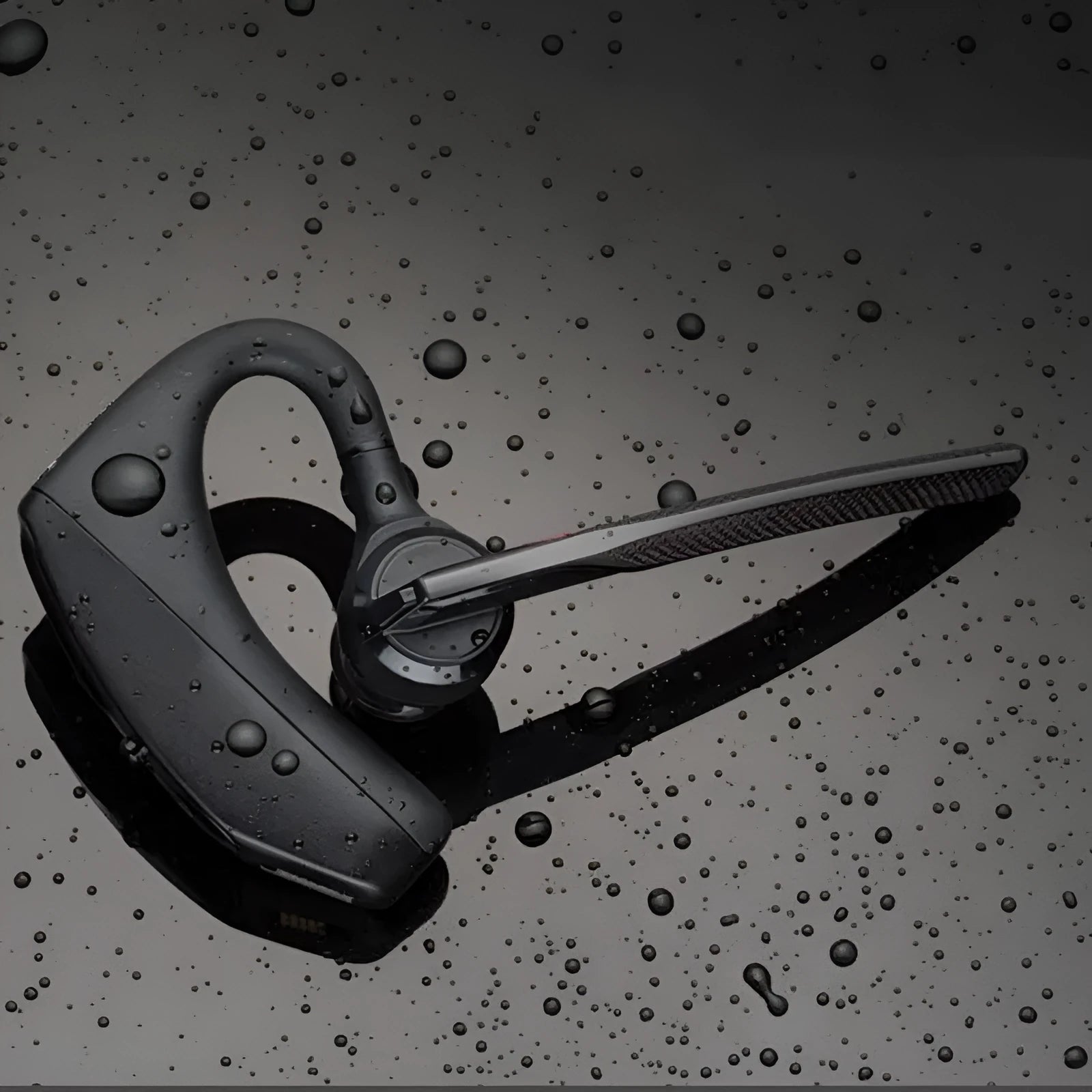Black stereo Bluetooth sports headphones with USB cable and battery display, shown on a simple background.