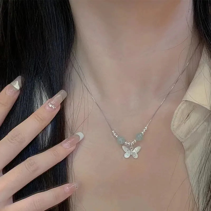 Copper bracelet and necklace set with silver electroplating and butterfly designs featuring Hetian jade accents