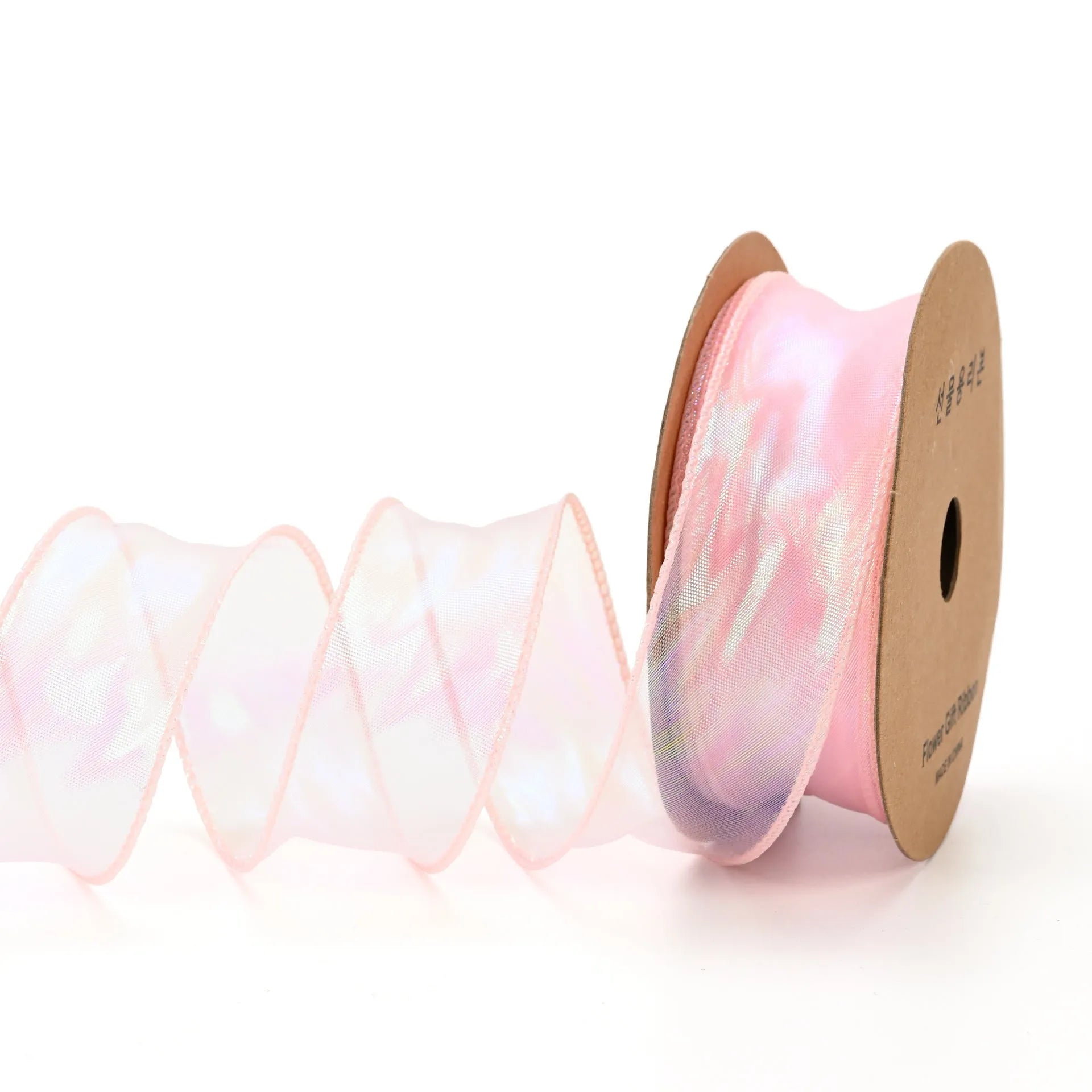 Roll of colourful wave patterned fishtail yarn decorative ribbon in mesh material, 4cm wide.