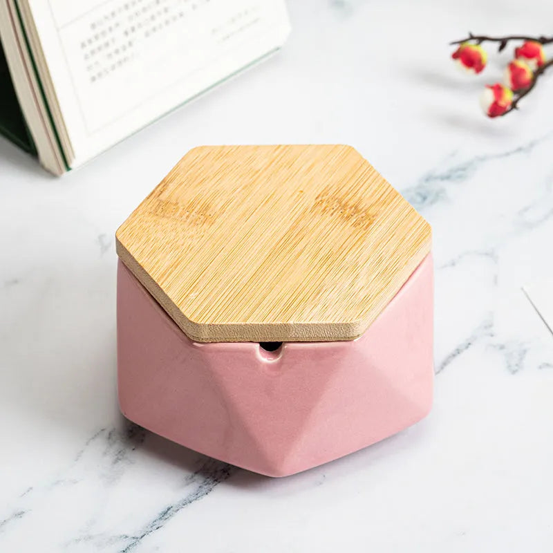 Ceramic ashtray with lid, Nordic style, available in multiple colours, on a tabletop