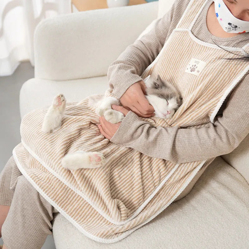 Cloth cat petting apron in a striped pattern, shown worn by a person holding a cat.