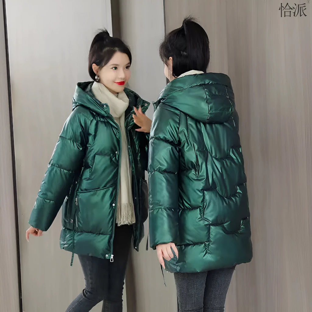 Women's loose-fitting long sleeve hooded jacket in black, shown on a hanger.