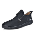 Men's black leather ankle boots with a front zip and round toe on a rubber sole