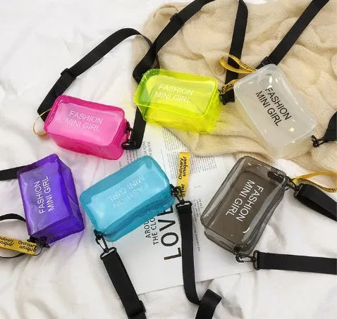Transparent square jelly shoulder bag in PC material with an adjustable strap, shown in a light colour.