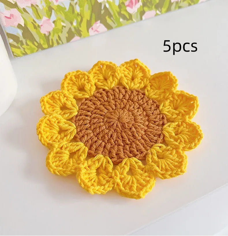 Hand-woven circular wool coaster with floral pattern, 10.5cm diameter