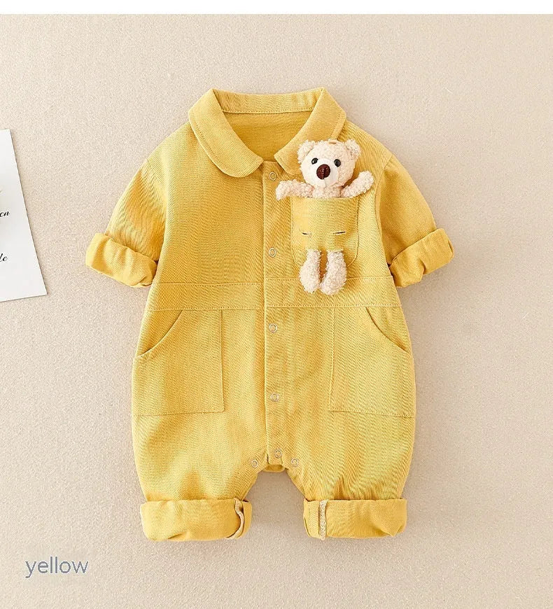 Baby boy wearing blue denim jumpsuit with teddy bear accessory, western style for Spring Festival