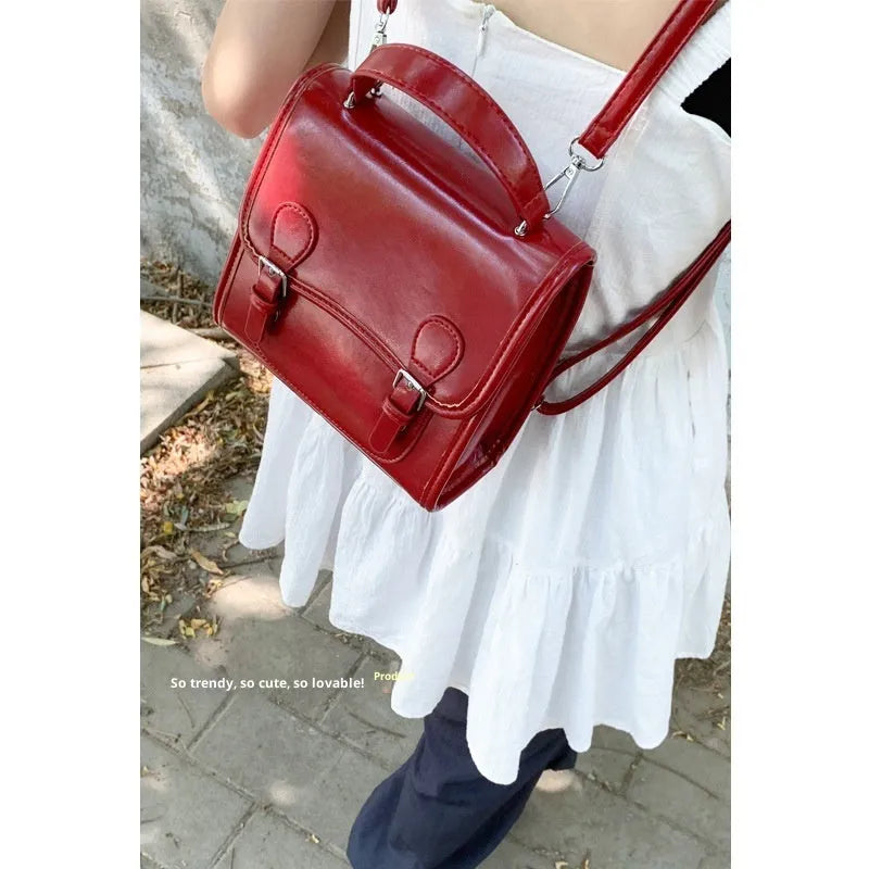 Simple PU college backpack in white, black, wine red, or silver with polyester lining and sewing thread detail