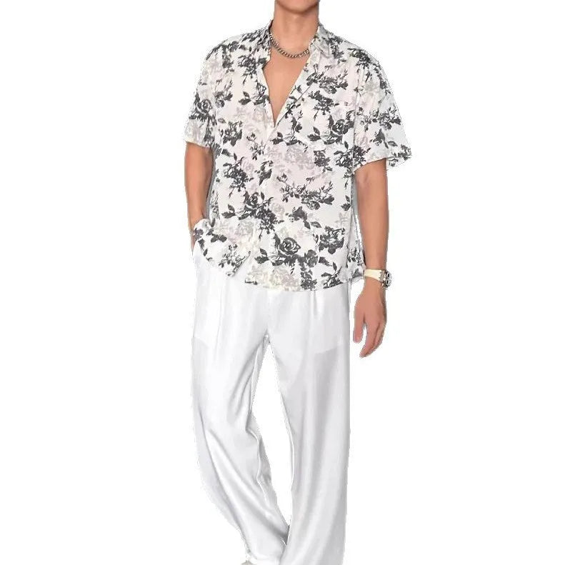 Women's loose-fit floral print short sleeve shirt in white, shown with a cardigan-style button front.
