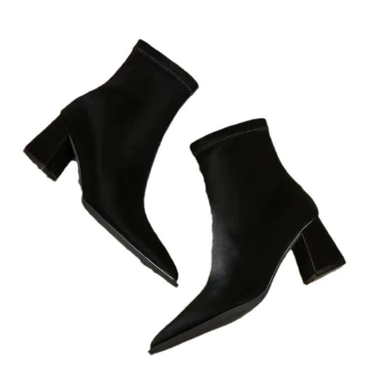 Women's khaki stretch artificial velboa ankle boots with a wedge heel and pointed toe on a plain background.