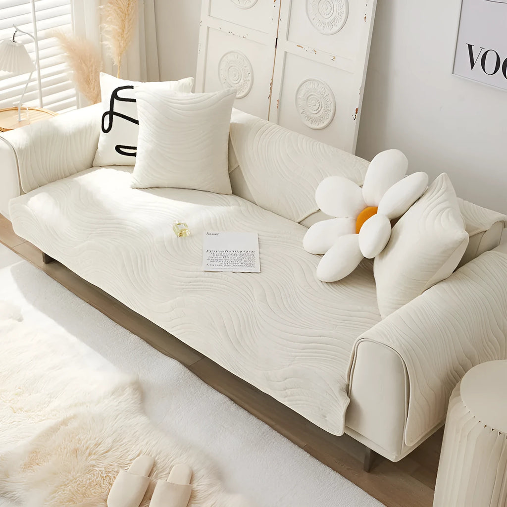 Thickened non-slip flannel sofa cover with geometric pattern in beige on a modern sofa
