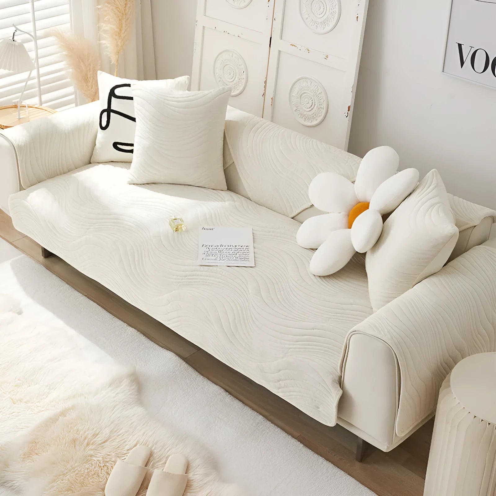 Thickened non-slip flannel sofa cover with geometric pattern in beige on a modern sofa