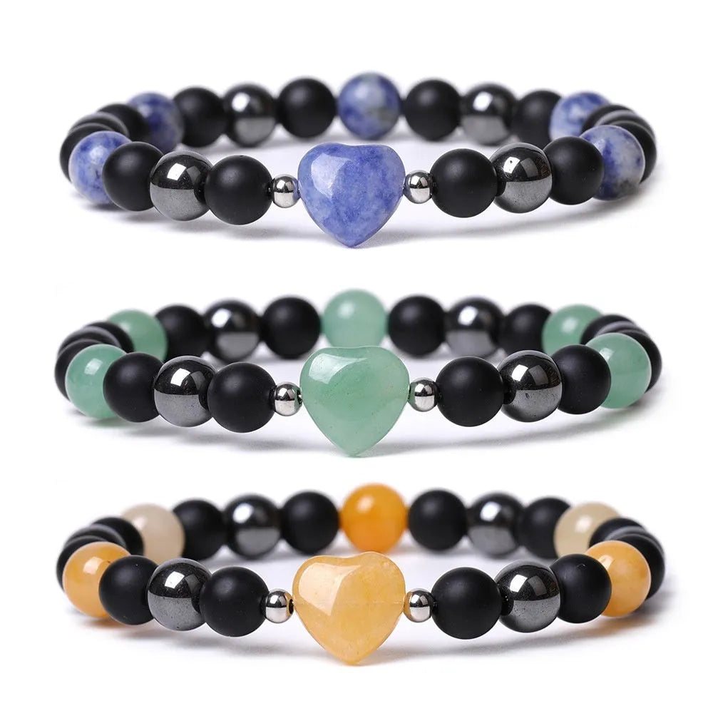 Hand-cut stone peach heart bracelet in Tigereye with geometric design and celestial moon planet motifs