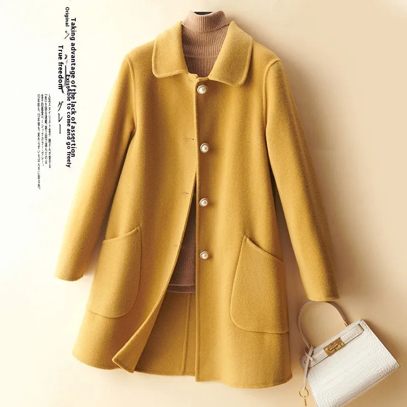 Women's double-faced wool coat with doll collar and pearl buckle in mid-length cut