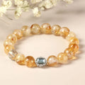 Citrine crystal bracelet with 10mm geometric shapes on wrist.