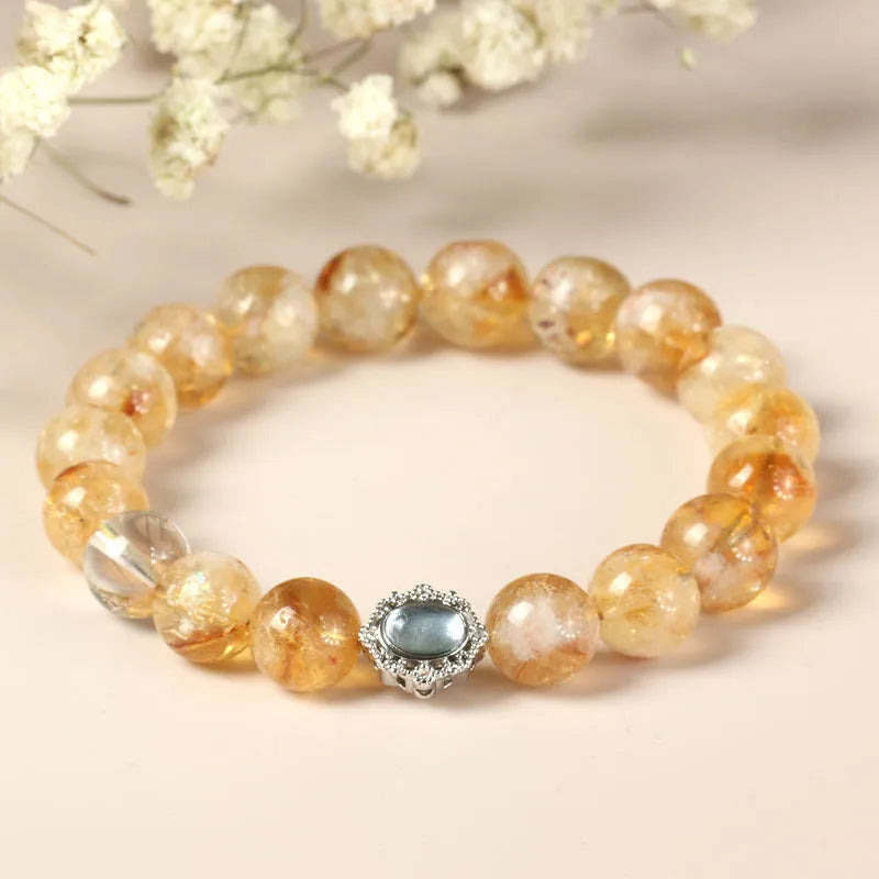 Citrine crystal bracelet with 10mm geometric shapes on wrist.