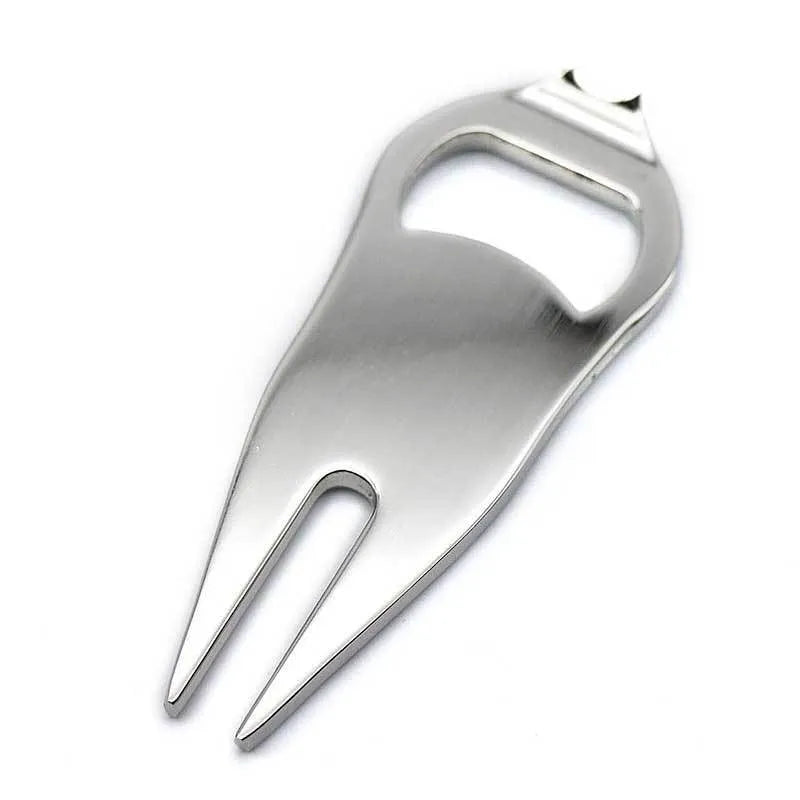 Zinc alloy golf multi-tool with ball yoke, bottle opener, and fork end on a green background.