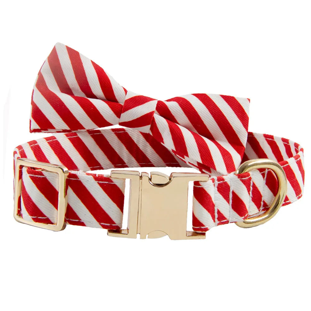 Striped green dog collar with adjustable buckle and a matching bow, showing custom engraving space.