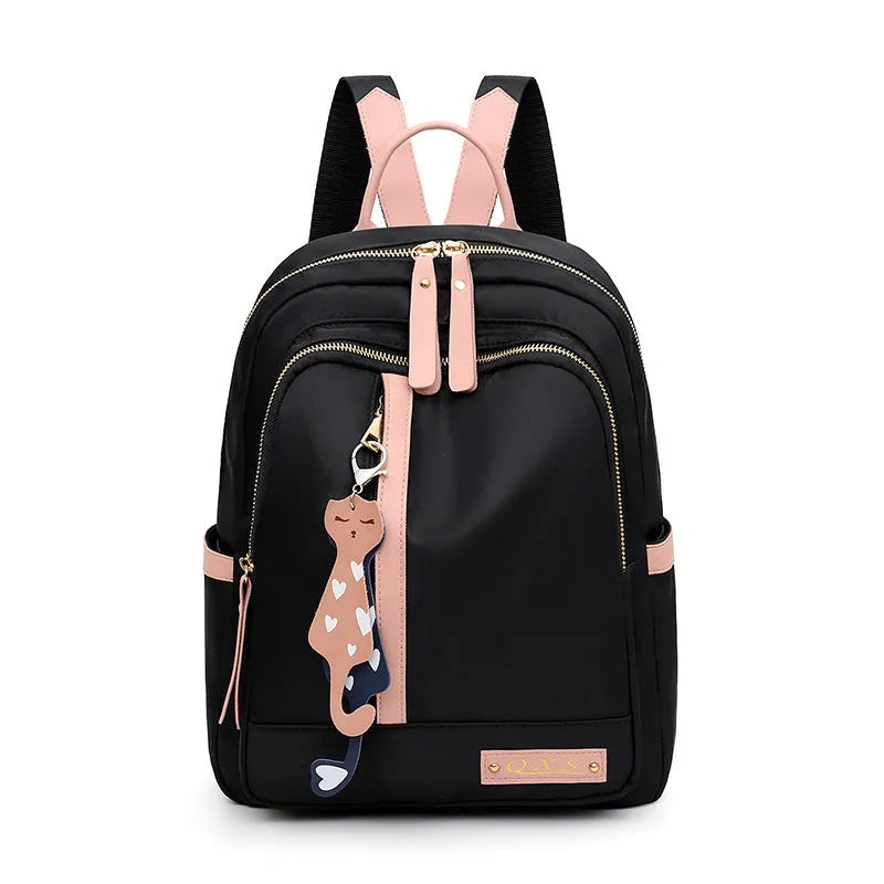 Black casual nylon backpack with shoulder straps, showing internal organiSation pockets and a soft handle.
