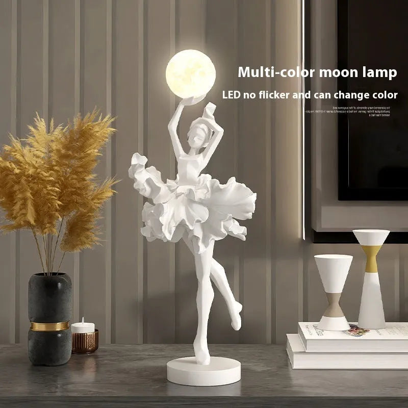 Small modern resin night light ornament with USB charging cable in black gold colour.