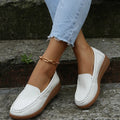 Women's flat slip-on shoes in PU leather, shown in multiple colours with a round toe and rubber sole.