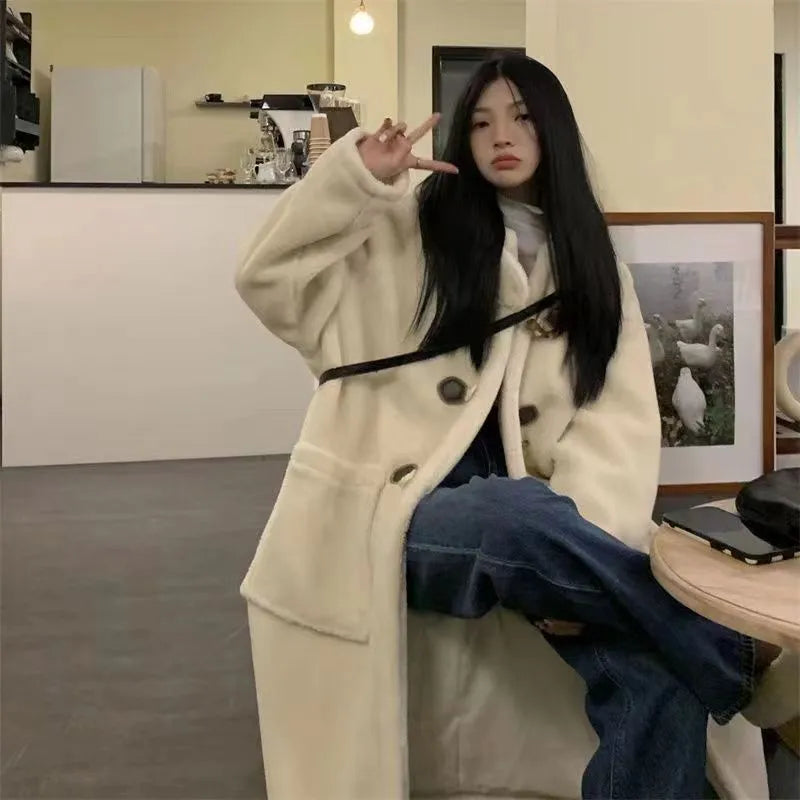 Women's mid-length lamb wool coat in apricot with horn button front closure