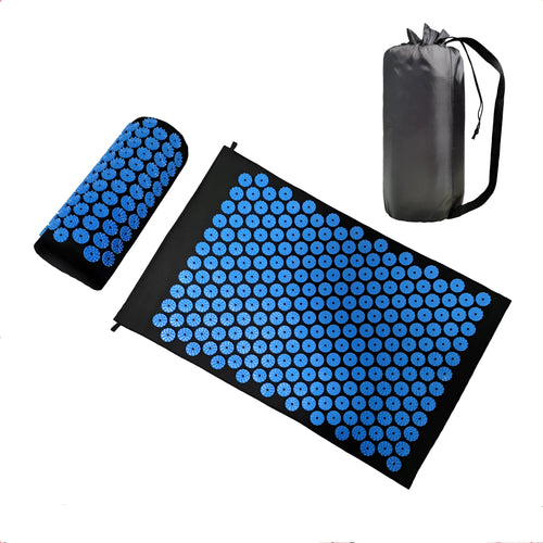 Black and blue acupuncture massage mat with cushion and headrest on floor