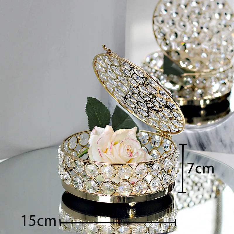 Transparent crystal glass jewelry box with a French gold metal frame in a European style.