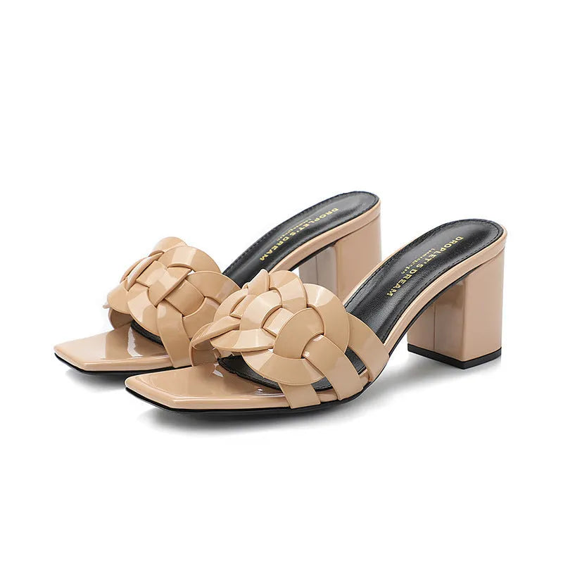 Handmade woven chunky heel slippers in patent leather with sheepskin lining, shown in apricot colour