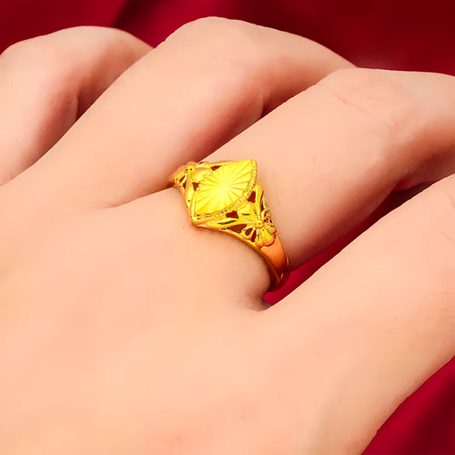 Adjustable gold-coloured brass floral ring with openwork design and textured diamond details.