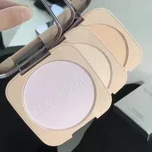 Open compact of oil control pressed powder showing a matte powder surface, with 15g net content and shade options listed.