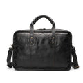 Brown vintage men's leather briefcase open to show internal laptop, document, and camera pockets.