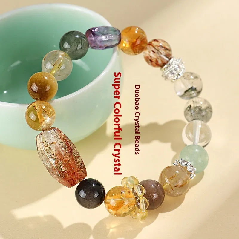 Close-up of a handmade black and gold natural crystal bead bracelet for women.