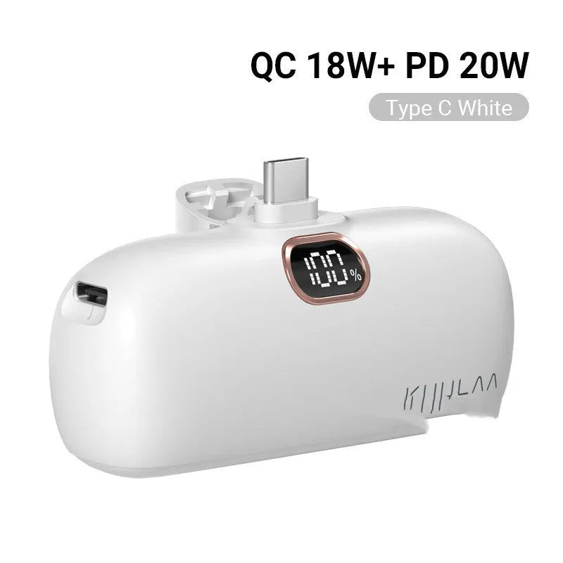 Compact cylindrical alloy power bank with built-in charging cable and LCD digital display.