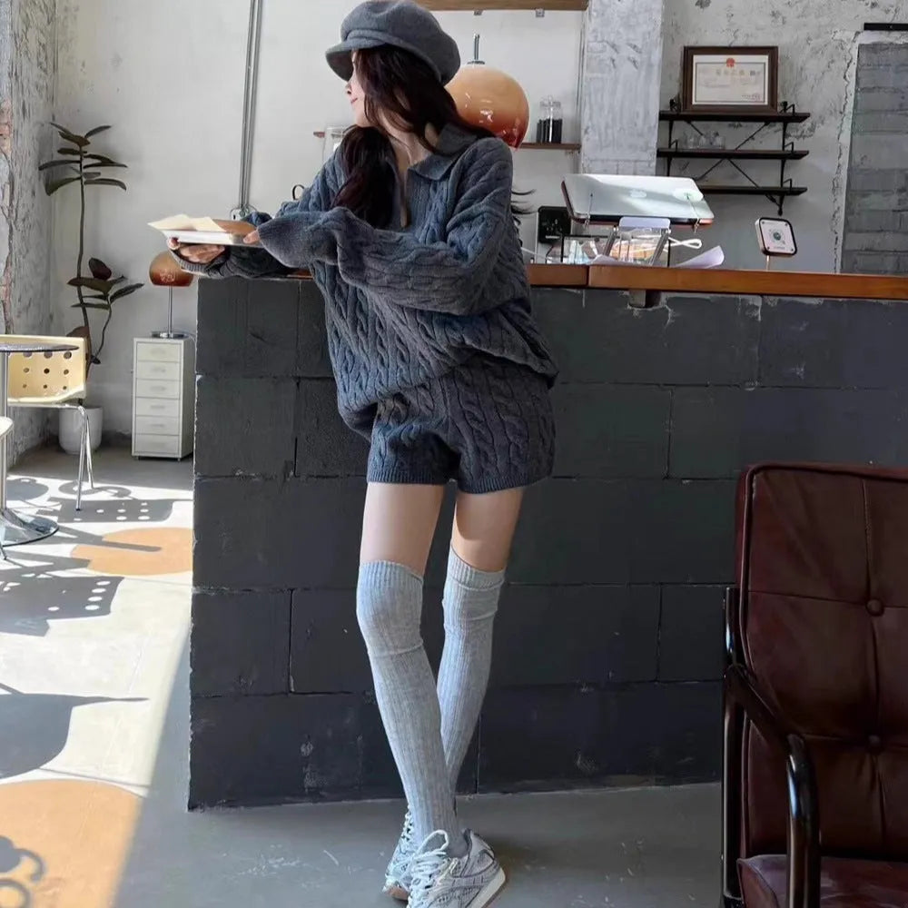 Creamy-white women's cable-knit jumper and matching shorts set with geometric pattern and elasticated waistband.