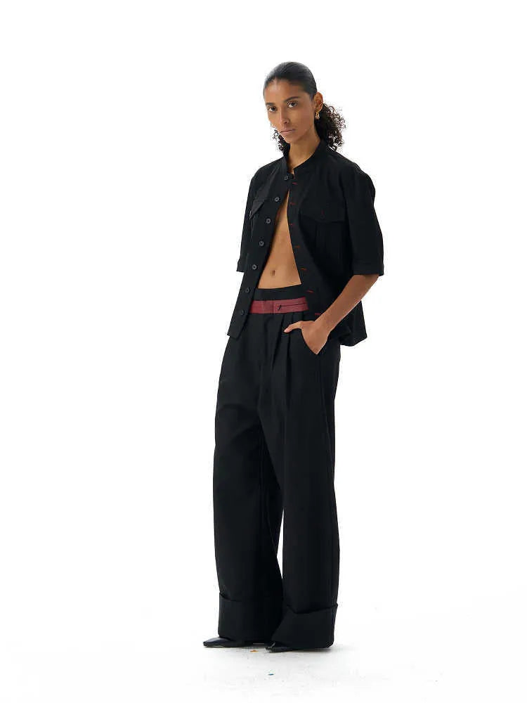 Black loose-fit half-sleeve hunting shirt with a shirt collar on a hanger.