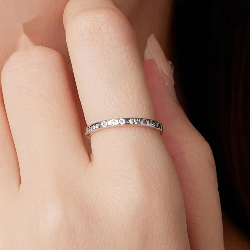 Silver coloured I Love You ring with oxidised black finish, simple bracelet band style.