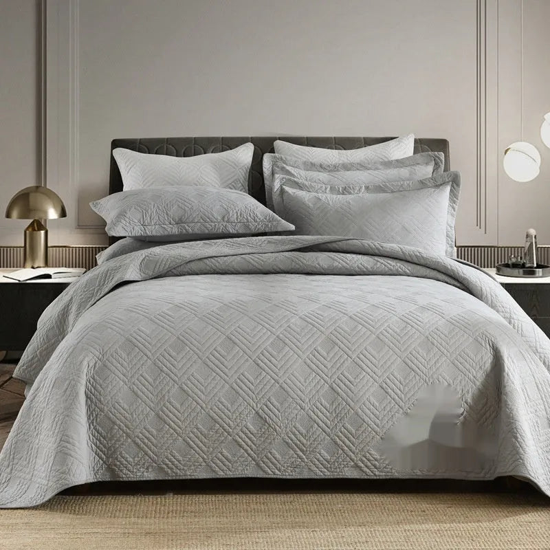 Double-sided pure cotton bed cover three-piece set in a light grey damascus pattern on a bed.