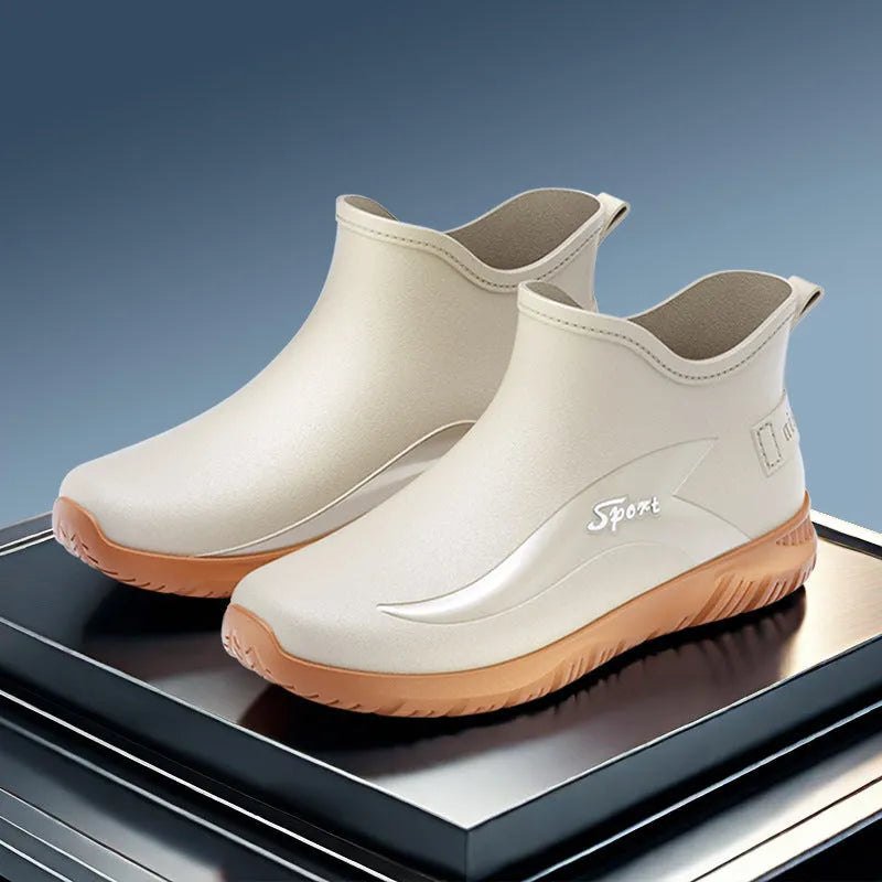 Men's short PVC rubber boots in beige with a flat heel and non-slip sole.