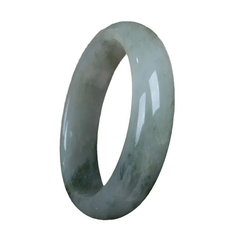 Natural Jinsi Jade Chinese style bangle bracelet on a plain background.