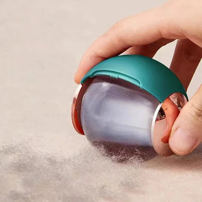 Reusable ABS hair removal ball lint roller in pink, showing handle and sticky roller surface.