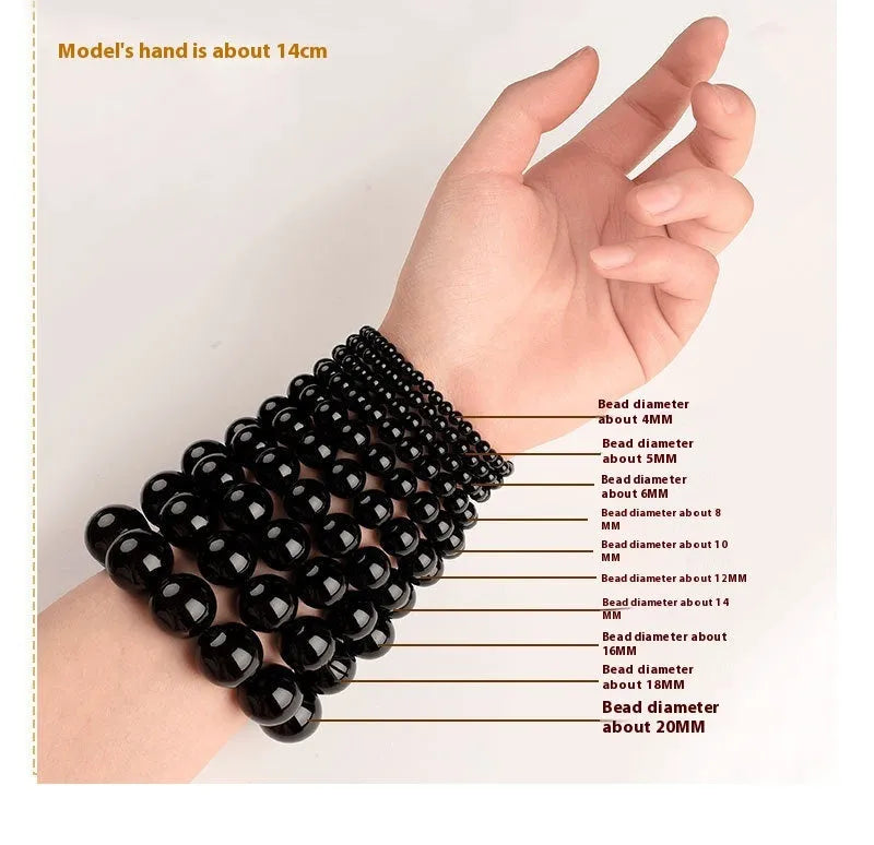 Natural smokey violet Hetian jade straight cut bead bracelet on a wrist.