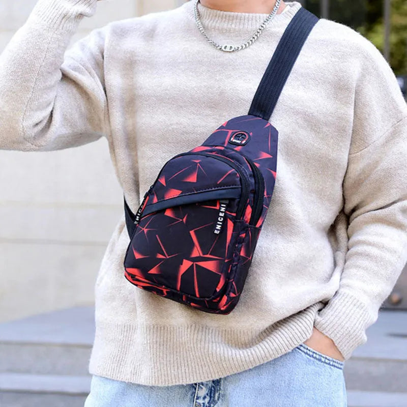 Blue men's crossbody sling bag with earphone hole, made from Oxford cloth, showing front zipper and strap.