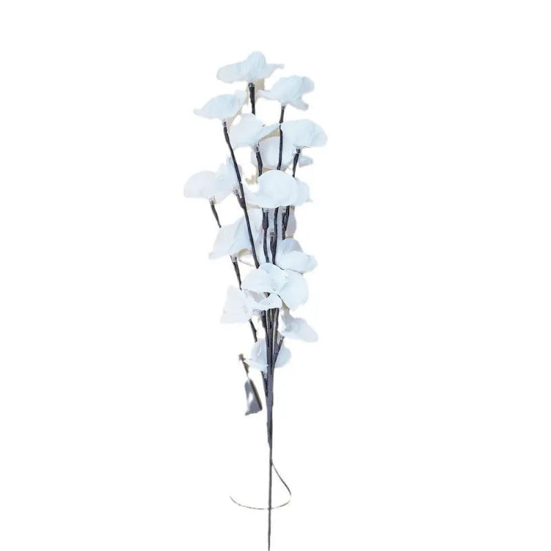 A 65cm tall pink LED phalaenopsis orchid branch light with fabric petals, powered by batteries.