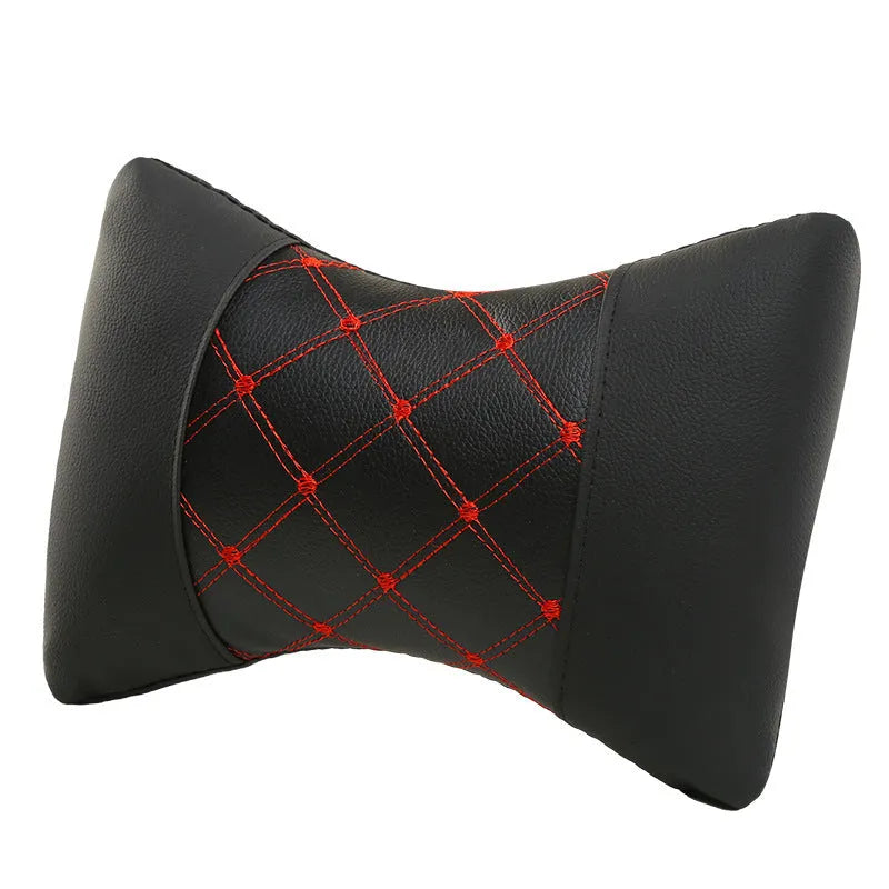 Black quilted artificial leather car headrest cover with coloured stitching lines.