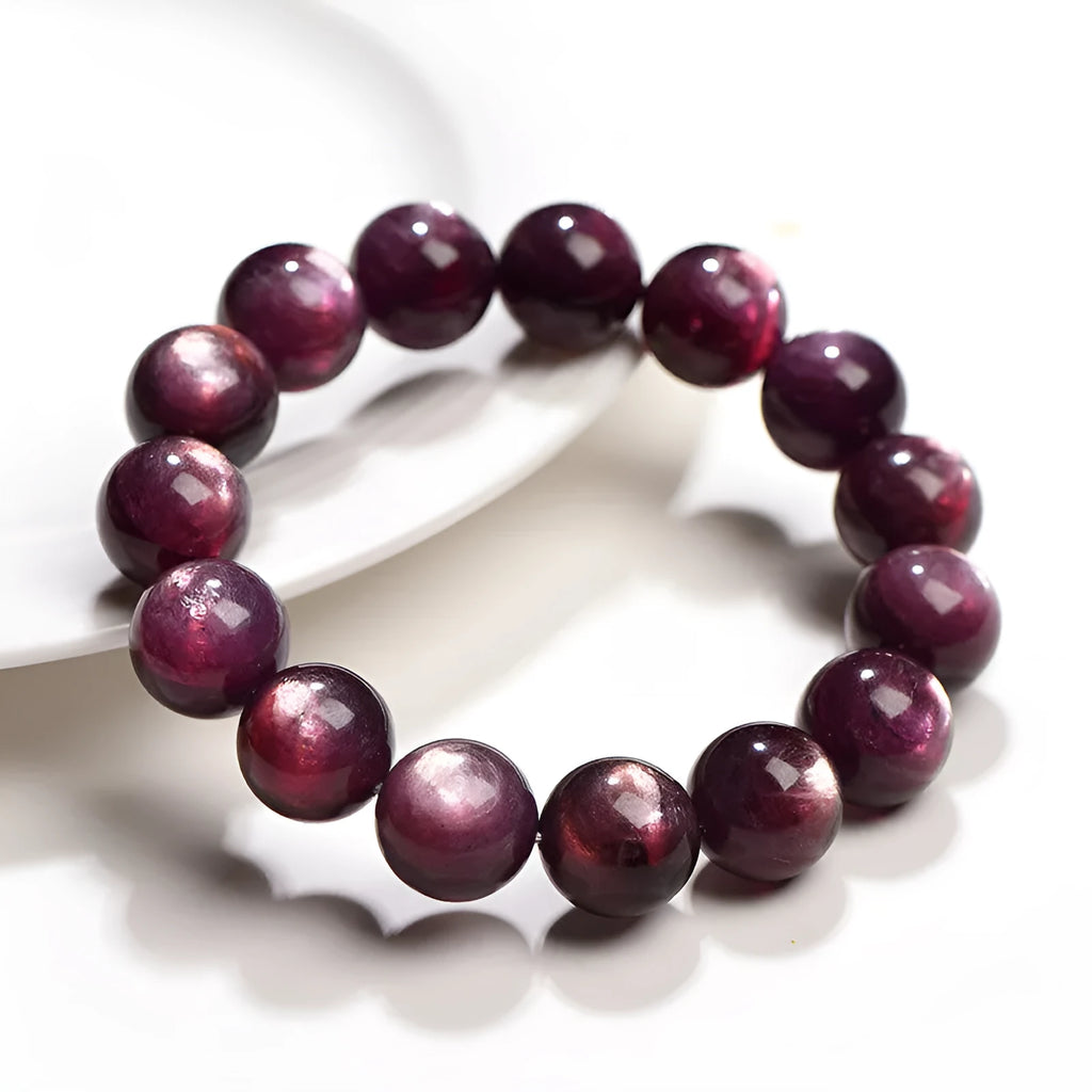 Natural purple lepidolite crystal bracelet with polished round beads, showing different size options.