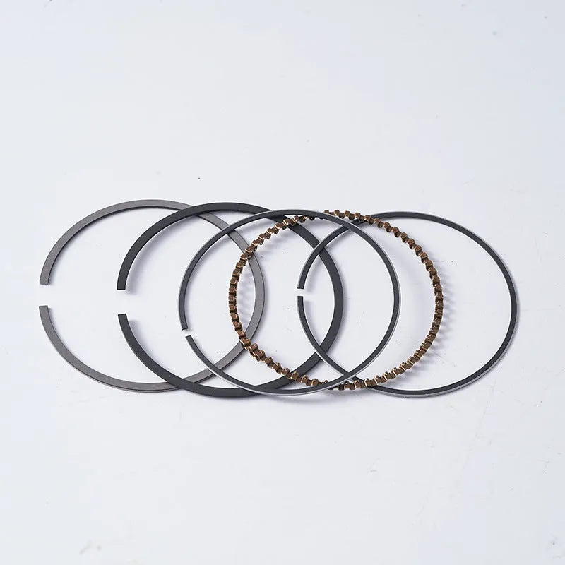 Motorcycle engine piston kit showing aluminium piston with steel combination oil ring for 57.4mm bore